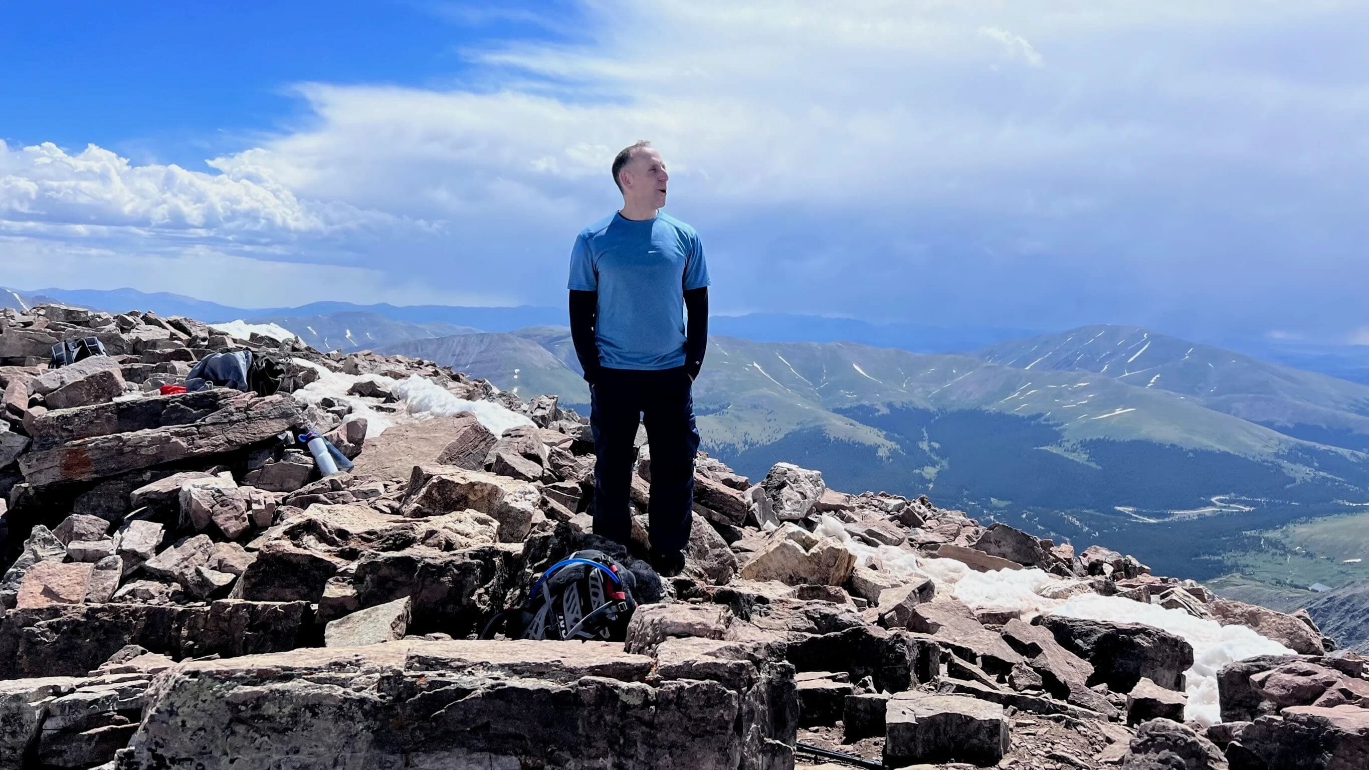 Russell Scherwin on a mountain peak